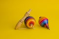 Mexican toys from Wooden, balero, yoyo and trompo in Mexico on a yellow background Royalty Free Stock Photo