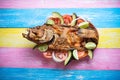 Fried fish on colorful background Royalty Free Stock Photo