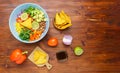 Mexican vegetable salad, cowboy caviar in bowl with ingredients and nachos. Top view. Copy space Royalty Free Stock Photo