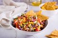 Mexican vegetable salad cowboy caviar and nachos in a bowl on the table Royalty Free Stock Photo