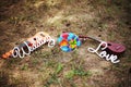 Mexican wedding. Sombrero hat, wedding bouquet, two guitars on the grass. Close up, outdoor. Bright blue, orange, brown, green, pu Royalty Free Stock Photo