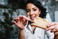 Mexican woman eating rosca de reyes or Epiphany cake, Roscon de reyes with traditional mexican chocolate cup