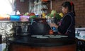 Mexican woman making quesadillas