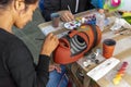 Mexican woman painting mask in alebrije style, Oaxaca, Mexico Royalty Free Stock Photo