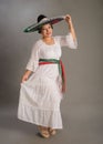 Mexican woman with positive attitude wearing a mariachi hat