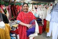 Mexican woman selling traditional mexican shawl and clothes in