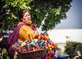 Mexican woman with traditional dress selling handcrafts Royalty Free Stock Photo