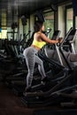 Mexican Women On Elliptical Treadmill In Fitness Gym