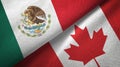 Mexico and Canada two flags textile cloth, fabric texture Royalty Free Stock Photo