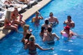 Mexico, Cancun. Group of young people relaxing and sunbathing in the pool. Cancun Grand Pyramid entertaining c Royalty Free Stock Photo