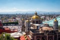 Mexico City, Mexico, Basilica of Our Lady of Guadalupe with Mexico City Skyline on a Sunny Day Royalty Free Stock Photo