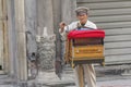 Man playing wooden organ in Mexico City, organ grinder in the city centre