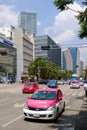 Urban scene with traditional pink taxis in downtown Mexico City