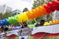 Allegorical car decorated with balloons that paint Mexico City with the rainbow aboard members of the LGBTTI community
