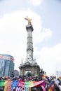 Under the representative Victoria alada or angel of Mexico City protesters proudly hold the banner that reads # love is love in m