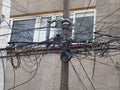 Mexico City Messed up power lines and connection cables. Many tangled wires on electric poles in the city Royalty Free Stock Photo