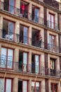 Man on balcony historic building