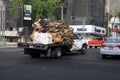 Mexico City, Mexico - November 27, 2015: Refuse/Recycling truck carrying waste cardboard by road in Mexico City