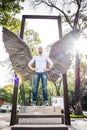 Mexico City, Mexico - November 1, 2018. Tourist posing with angel`s wings