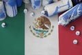 Mexico flag and few used aerosol spray cans for graffiti painting. Street art culture concept