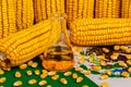 Mexico flag, laboratory beaker and corn kernels.