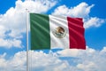 Mexico national flag waving in the wind on clouds sky. High quality fabric. International relations concept Royalty Free Stock Photo