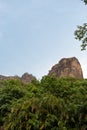 View from below the Tepozteco hill surrounded by vegetation.