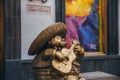 MEXICO - SEPTEMBER 25: Bronze statue of a fat mariachi guitar pl