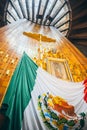 MEXICO - SEPTEMBER 20: Cross, image of the virgin of Guadalupe and Mexican flag at Basilica of our Lady Guadalupe Royalty Free Stock Photo