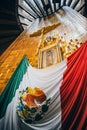 MEXICO - SEPTEMBER 20: Cross, image of the virgin of Guadalupe and Mexican flag at Basilica of our Lady Guadalupe