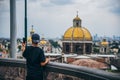 MEXICO - SEPTEMBER 20: Man taking photo of Basilica of Guadalupe Square