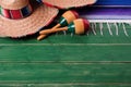 Mexico sombrero border mexican maracas old green wood background Royalty Free Stock Photo