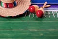 Mexico sombrero fiesta wood background mexican maracas