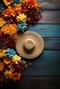 Mexico sombrero hat and flowers. Cinco de mayo, blue wood background with copy space top view Royalty Free Stock Photo