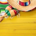 Mexico sombrero maracas cinco de mayo fiesta wood background Royalty Free Stock Photo