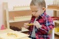 Cute little boy in the classroom early development.