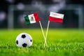 Mexico vs. Poland, Stadium 974,, Football match wallpaper, Handmade national flags and soccer ball on green grass. Football Royalty Free Stock Photo