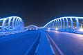 Meydan Bridge and street road or path way on highway with modern architecture buildings in Dubai Downtown at night, urban city at