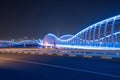Meydan Bridge and street road or path way on highway with modern architecture buildings in Dubai Downtown at night, urban city at