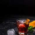 Mezcal Negroni cocktail. Smoky Italian aperitivo. Orange peel.