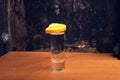 Mezcal shot on rustic background with space for text.