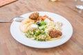 Mezze or selection of typical Arabic appetizers on a white dish