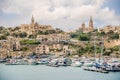 View at the harbour of Mgar town with churches in Gozo ,Malta