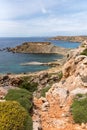 Panorama of Gnejna bay, the most beautiful beach in Malta at sunset with beautiful colorful sky and golden rocks