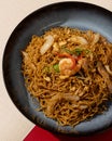 Mi Goreng is a noodle dish cooked with stir-fried vegetables typical of Hong Kong