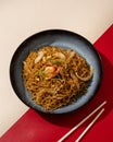 Mi Goreng is a noodle dish cooked with stir-fried vegetables typical of Hong Kong