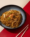 Mi Goreng is a noodle dish cooked with stir-fried vegetables typical of Hong Kong