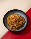 Mi Goreng is a noodle dish cooked with stir-fried vegetables typical of Hong Kong