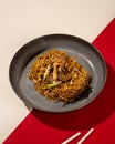 Mi Goreng is a noodle dish cooked in a typical Indonesian stir-fry with pieces of beef