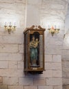 A statue of Our Lady with a baby in her arms hangs on the wall in the Greek Catholic Church in Mi`ilya in Israel